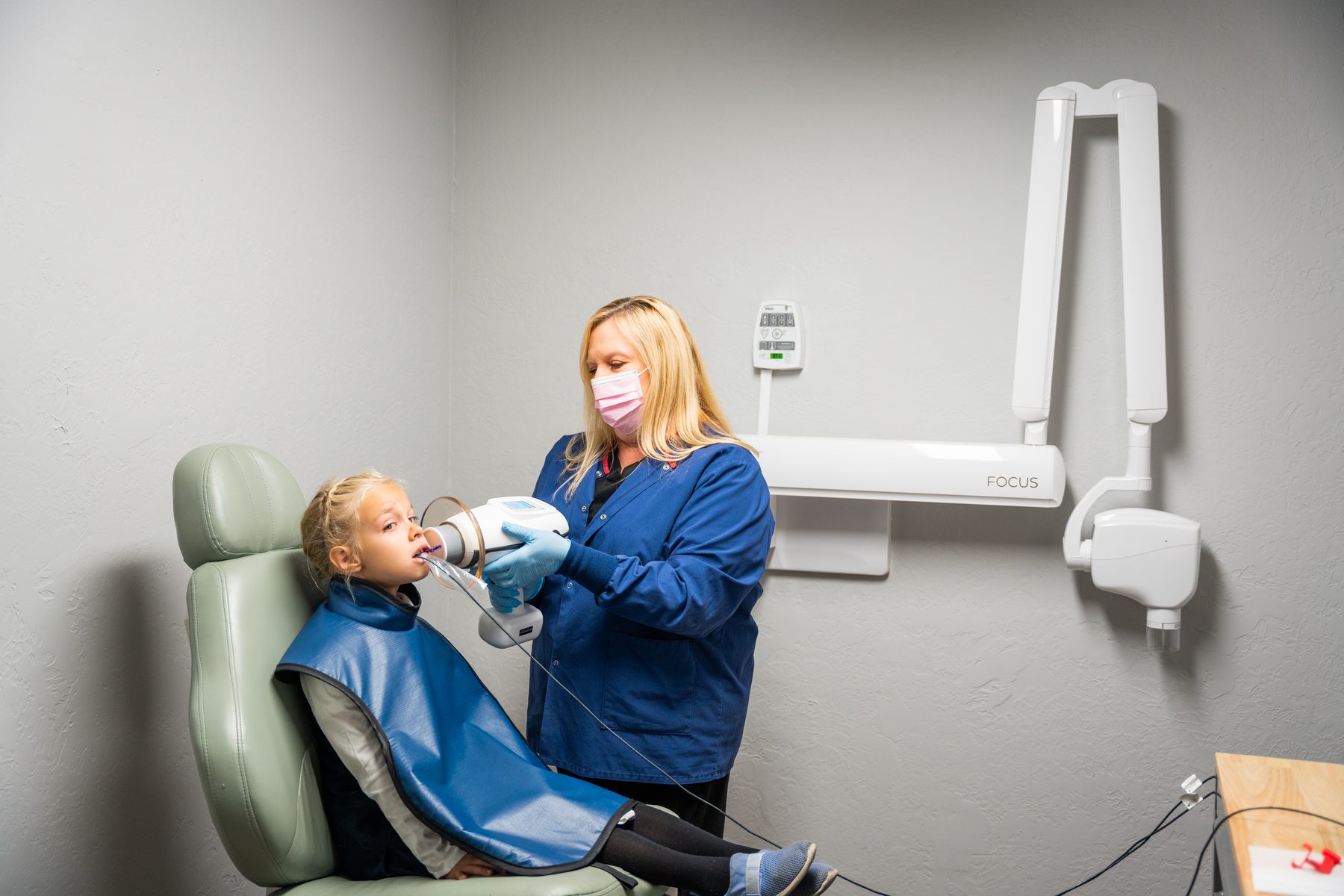 A toddler smiling during a dental checkup