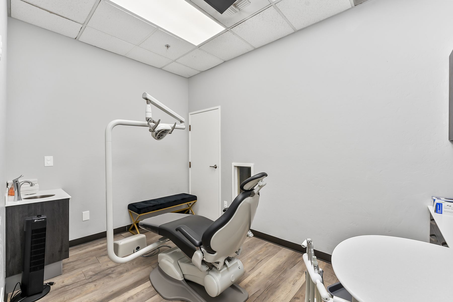Quiet single-chair room used for toddlers, sedation, and sensory-sensitive visits