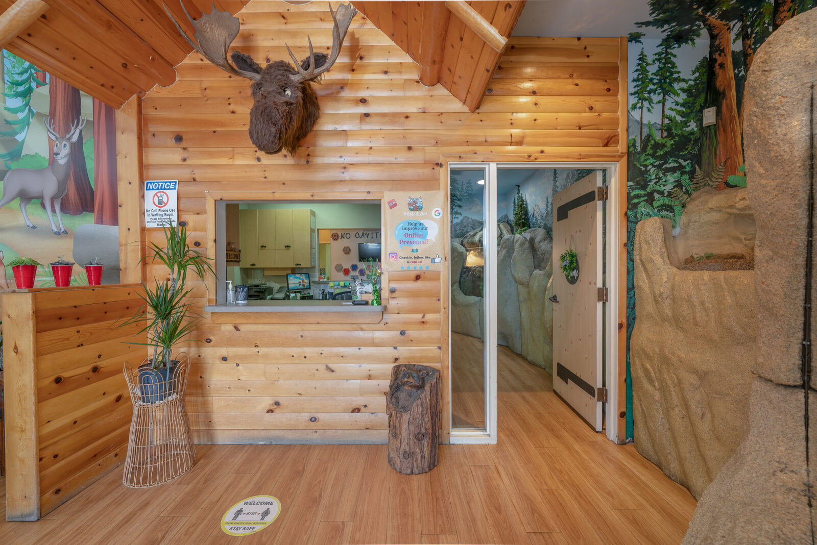 Wood-cabin reception desk with our moose centerpiece